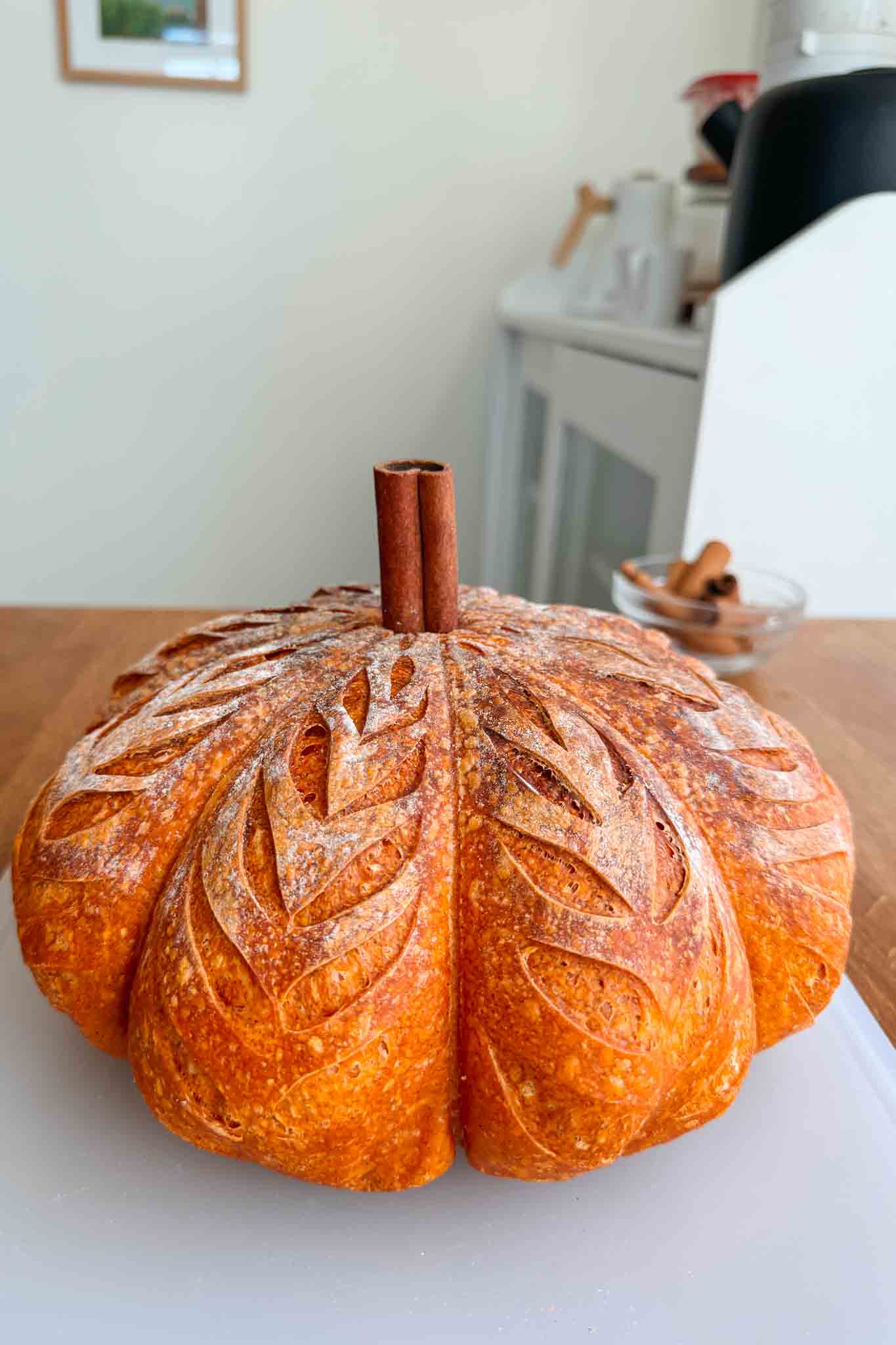 Finished pumpkin shaped sourdough bread with cinnamon stick stem. 