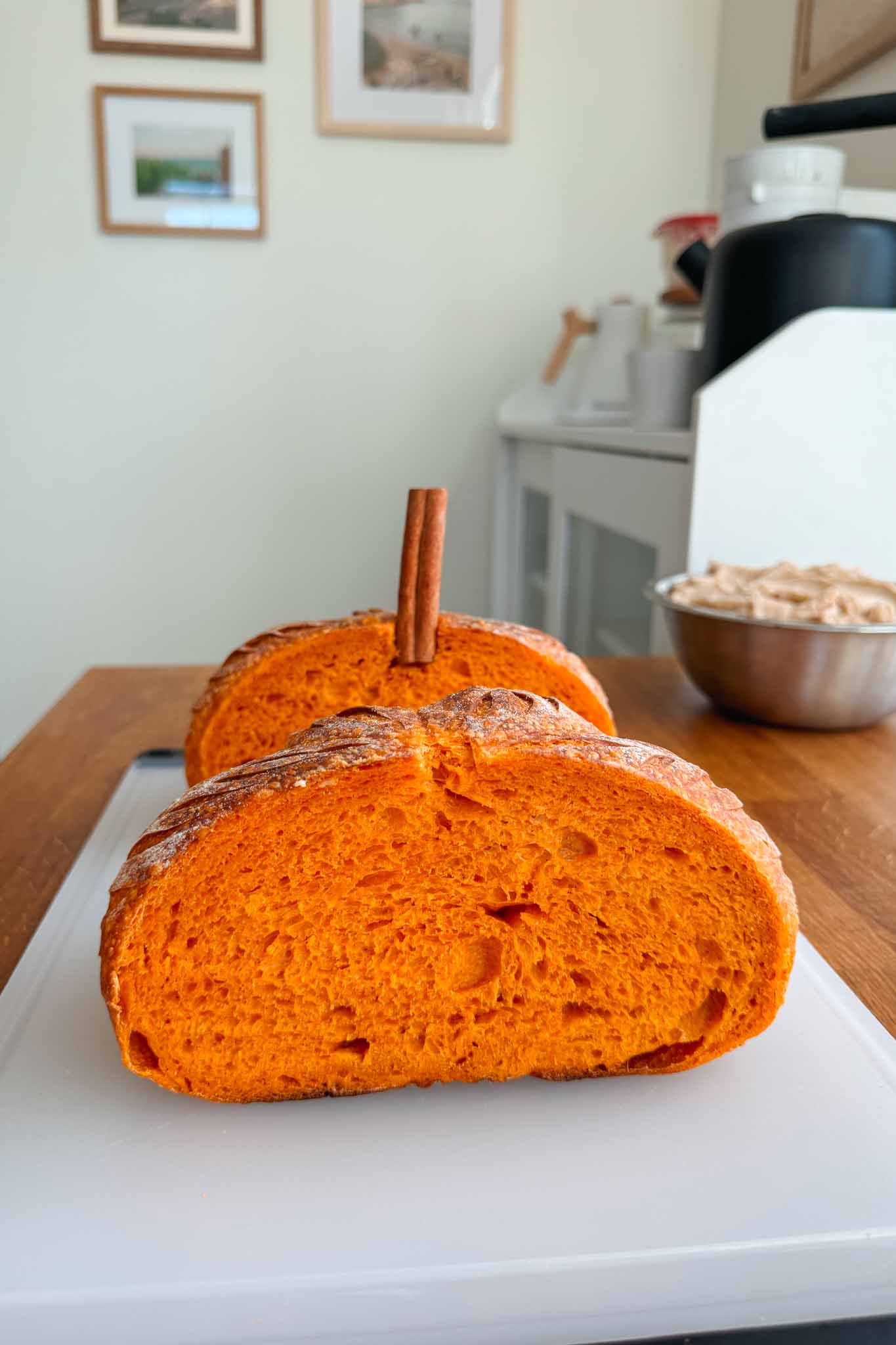 Pumpkin shaped sourdough bread cut in half. 