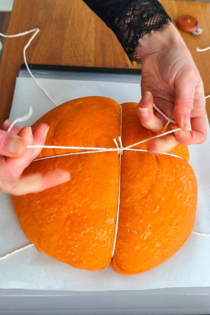 Typing pumpkin shaped dough with second string