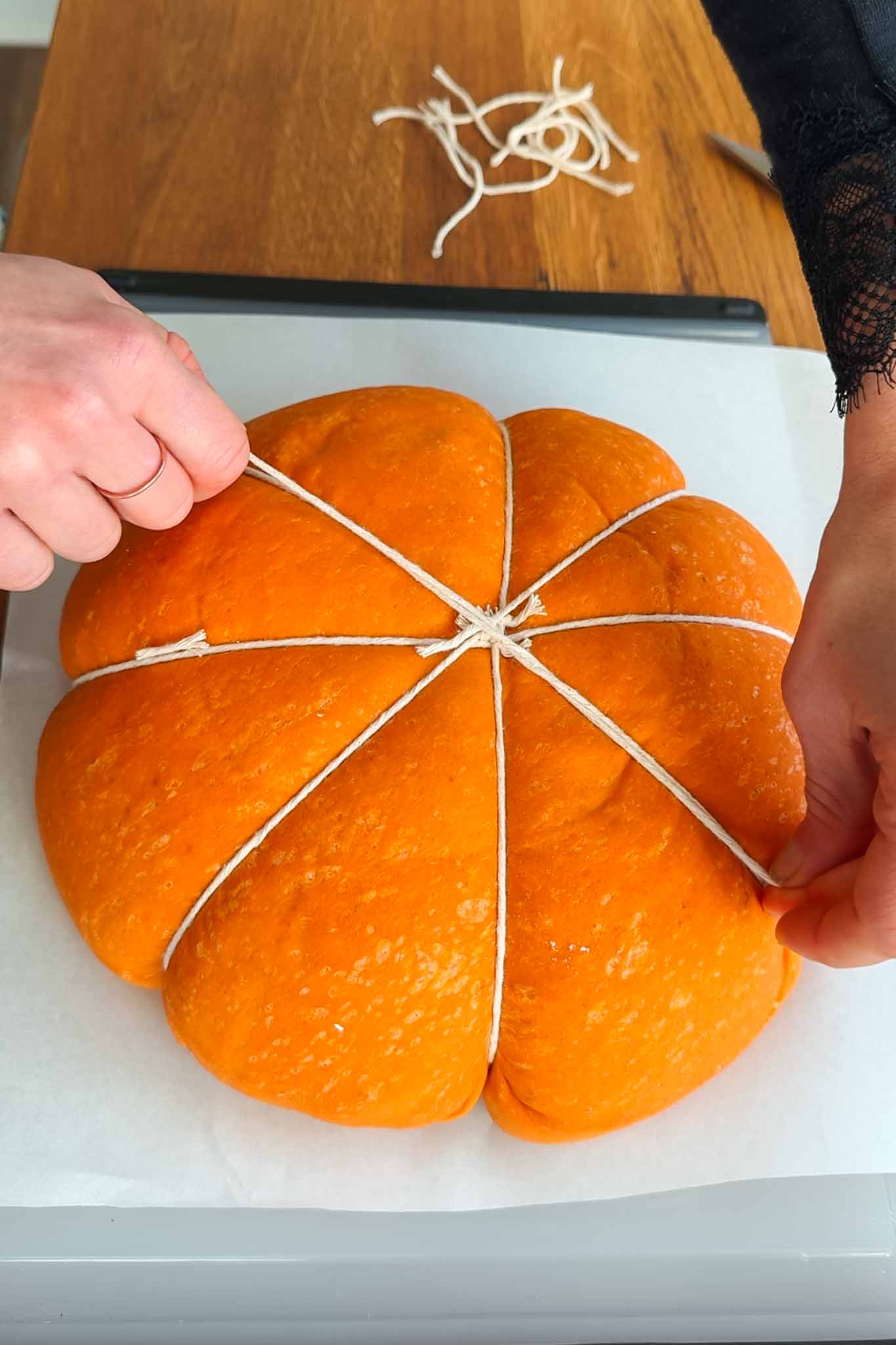 Typing pumpkin shaped dough with 4th string.