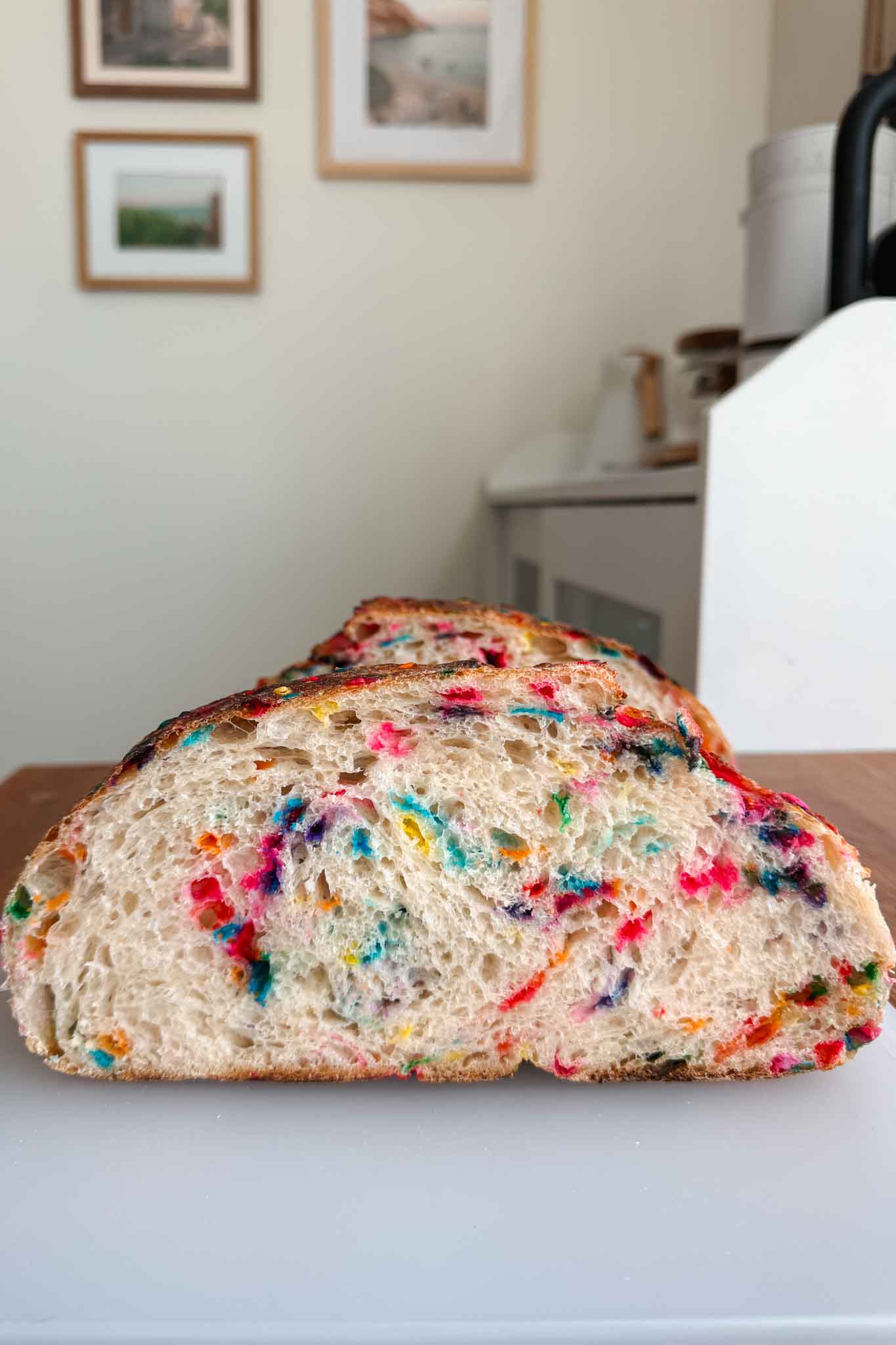 Funfetti sourdough bread half on cutting board