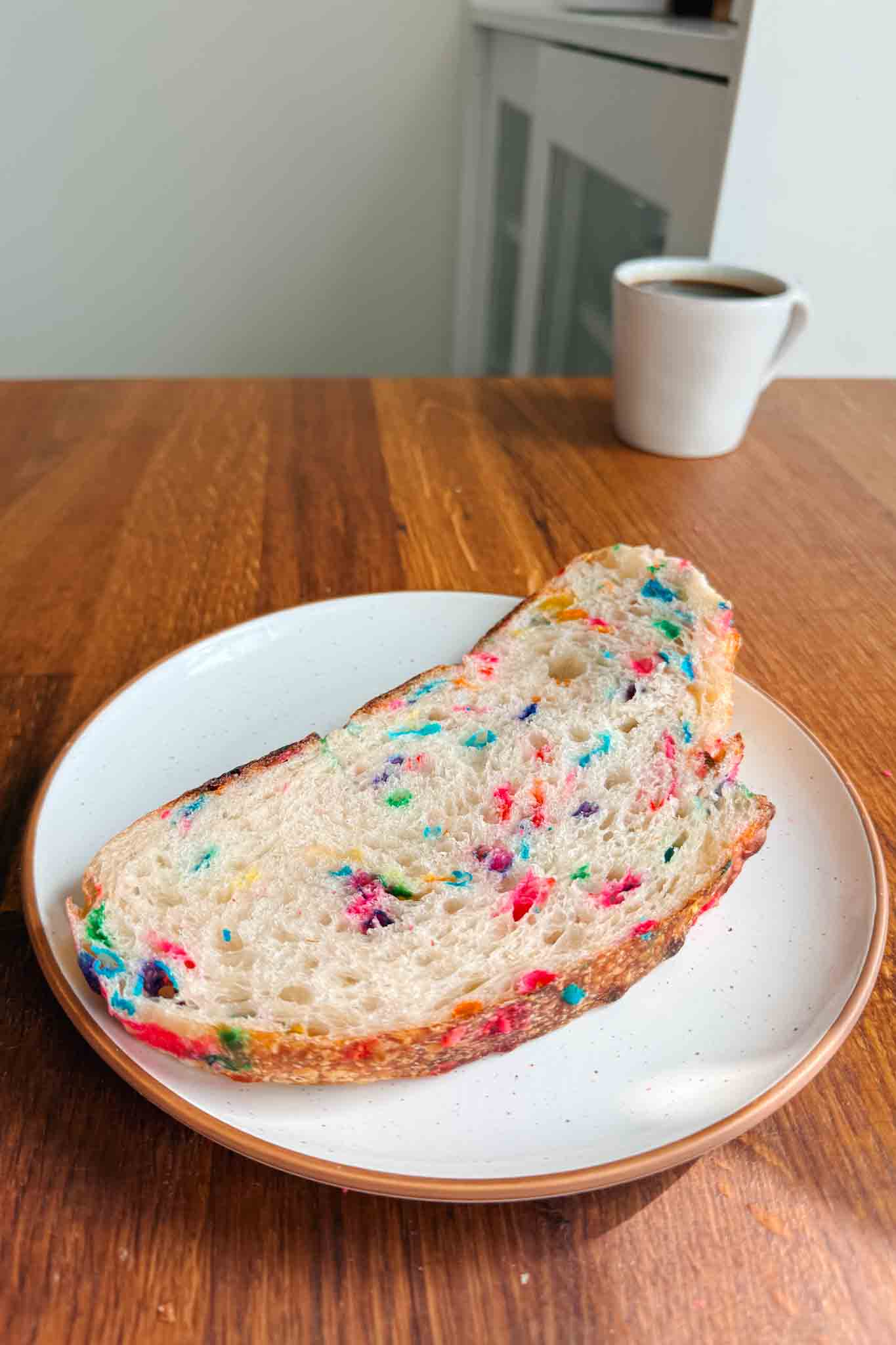 Funfetti sourdough bread slice on plate with coffee 